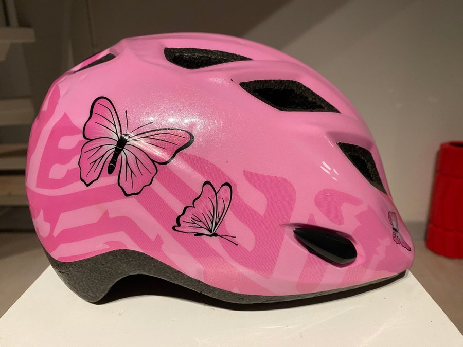 Barncykelhjälm MET, rosa med fjärilar