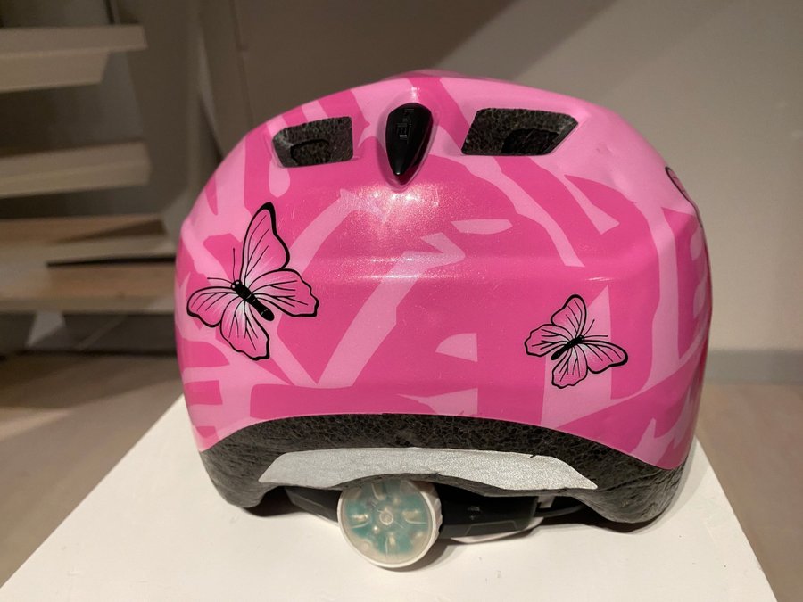 Barncykelhjälm MET, rosa med fjärilar