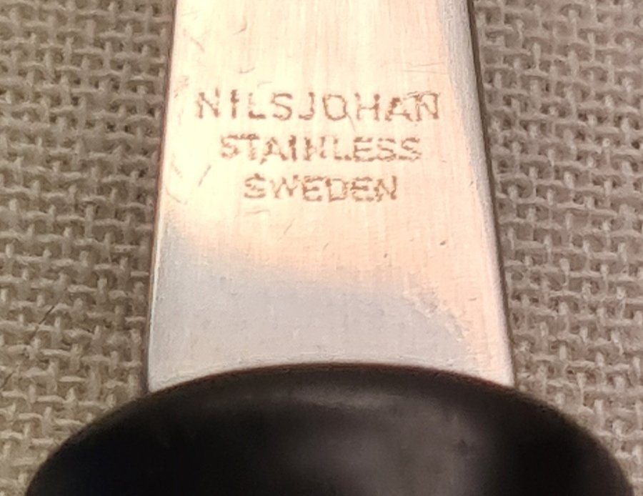 NilsJohan Sitting Bull Trancher-, Skinkbestck av Rf. Stål, Skaft av Svart Nylon